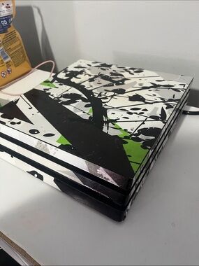 Sony PlayStation Console Skin in Black, White & Green Graphic Splash